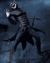 a statue of the joker laughing with chains around his arms