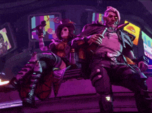 a man and a woman are sitting in front of a screen that says ' x '
