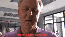 a man in a purple shirt says " hello captin gamez15 "