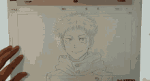 a person is drawing a picture of a boy on a piece of paper that says title on it