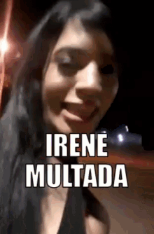 a woman is smiling with the name irene multada written on her face .