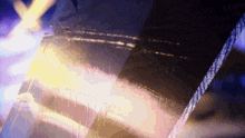 a blurred image of a person 's face with a purple background