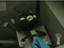 a cartoon cat is laying on a table with the word agile written on the wall behind it