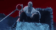 a man is sitting on a rock holding a sword and a ring .