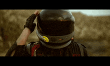 a person wearing a helmet with a yellow sticker on it that says ' a ' on it