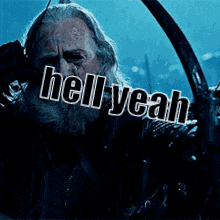 a man with long hair and a beard is holding a sword and says hell you