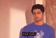 a man wearing a blue shirt with the word kya hua on it