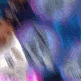 a blurry picture of a person 's face with a blue and purple background