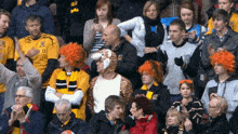 a man in a tiger costume stands in the crowd