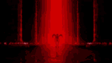 a close up of a person 's face with red eyes and a red background .