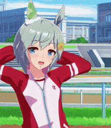 a girl in a red and white jacket with the letter c on the front