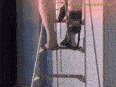 a person with a prosthetic leg is standing on a ladder with the website effedupmovies.com visible in the corner