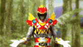 a red and yellow power ranger is standing in the woods