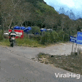 The Motorcycle Crashes Into The Signboard Viralhog GIF - The Motorcycle Crashes Into The Signboard Viralhog The Motorcycle Hits The Signboard GIFs