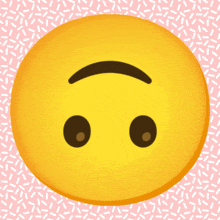 a yellow smiley face on a pink background