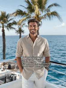 a man is standing on a balcony overlooking the ocean with a greeting in a foreign language