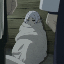 a white elf wrapped in a white cloth