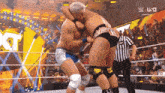 two men are wrestling in a wrestling ring with the word u.s.a. in the corner