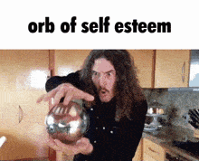 a man with long curly hair is holding a ball in his hands with the words orb of self esteem above him .
