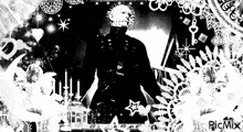 a black and white image of a man with candles and a key