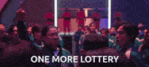 a crowd of people are cheering with the words one more lottery written in the foreground