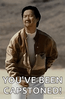 a man in a brown jacket is saying you 've been capstoned !