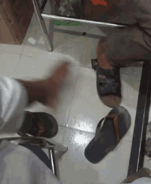 a person wearing flip flops and a person wearing sandals