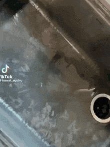 a close up of a sink with a hole in it and a tiktok watermark