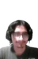 a man wearing glasses and headphones is smiling