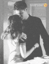 a black and white photo of a man hugging a woman with the words love you written above them