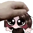 a person is putting a hat on a cartoon character .