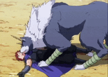a man is laying on the ground being attacked by a wolf with a horn