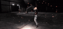 a person is holding a large sword in a dark room with sparks coming out of it