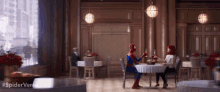 a man in a spiderman costume is sitting at a table with a woman in a restaurant .