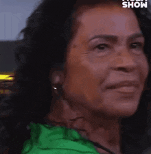 a close up of a woman 's face with the word show in the corner