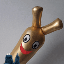 a stuffed animal that looks like a banana with a smiling face on it