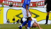 a soccer player in a blue jersey with the number 23 on it