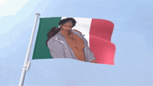 a flag with a shirtless man on it is waving in the wind