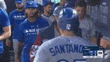a group of blue jays baseball players standing in a line