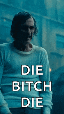 a man in a white sweater with the words " die bitch die " on it