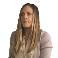 a woman with long blonde hair is wearing a purple sweater and a floral shirt