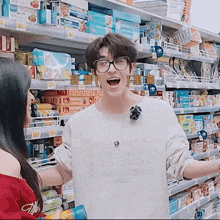 a man wearing glasses and a white shirt that says " i love you " on it