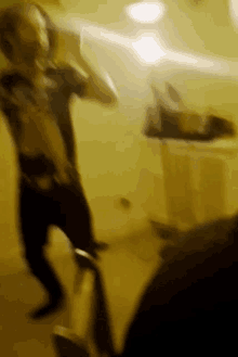 a blurry picture of a man dancing in a dark room
