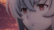 a close up of a girl with red eyes