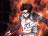 a man wearing sunglasses and a jersey with the number 23 on it is running with a ball .
