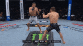 two men are fighting in a boxing ring with a bud light banner in the corner