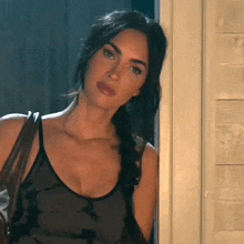 waiting by the door megan fox the expendables 4 leaning on the door smiles
