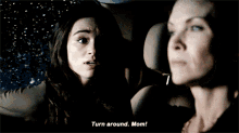 a woman says turn around mom in front of another woman 's face