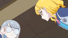 two anime girls are looking at each other and one has a badge on her jacket that says ' tokyo '