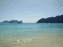 a large body of water with a few islands in the background